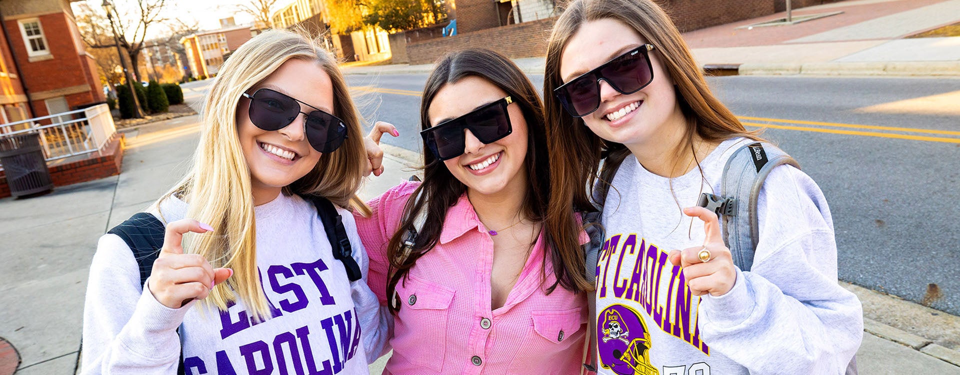 Alpha Phi Sorority sisters Marylynn Schrock, left, Isabella Vicidomini, Kaili Andre show how happy they are to be back on campus for the 2023 Spring Semester.